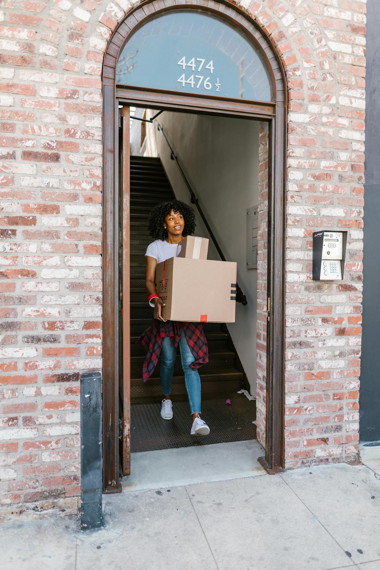 Moving boxes stacked outside a house ready to load